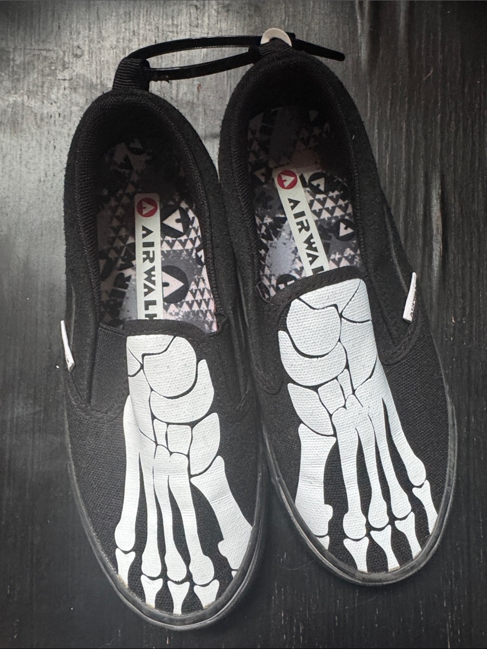 Airwalk kids Black Slip-On Loafers with White Skeleton Foot Graphic